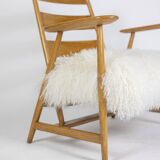 Pair of “lounge” armchairs in blond beech. 1950s