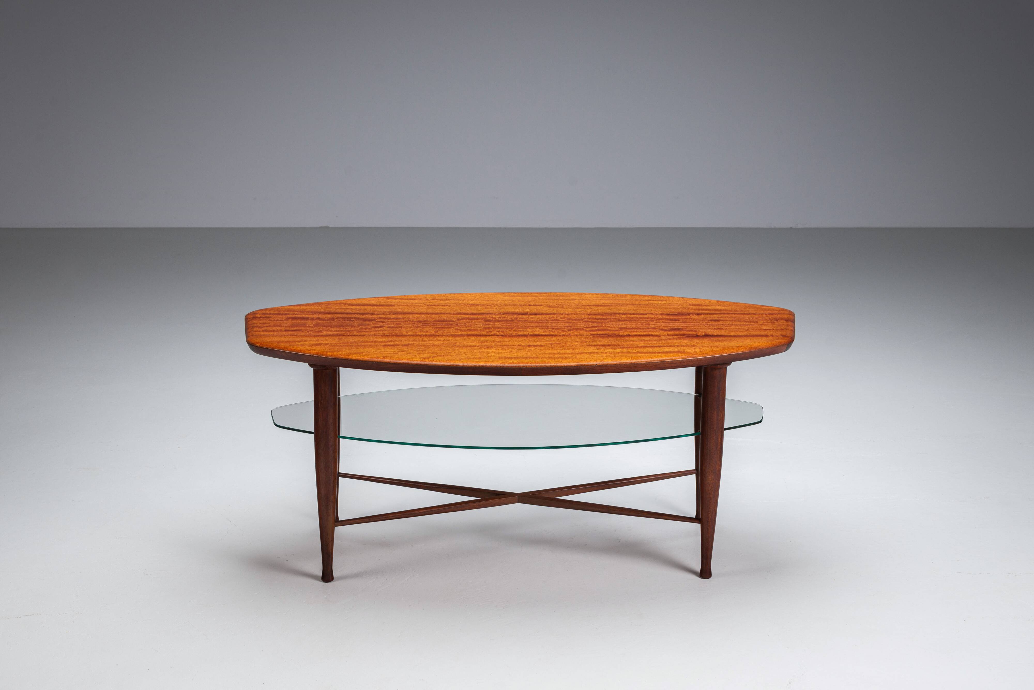 Assymetrical coffeetable with glass storage and cross leg details