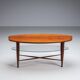 Assymetrical coffeetable with glass storage and cross leg details