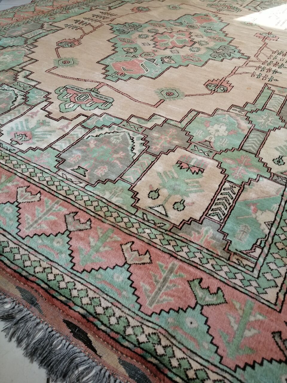 Afghan rug in pastel colors