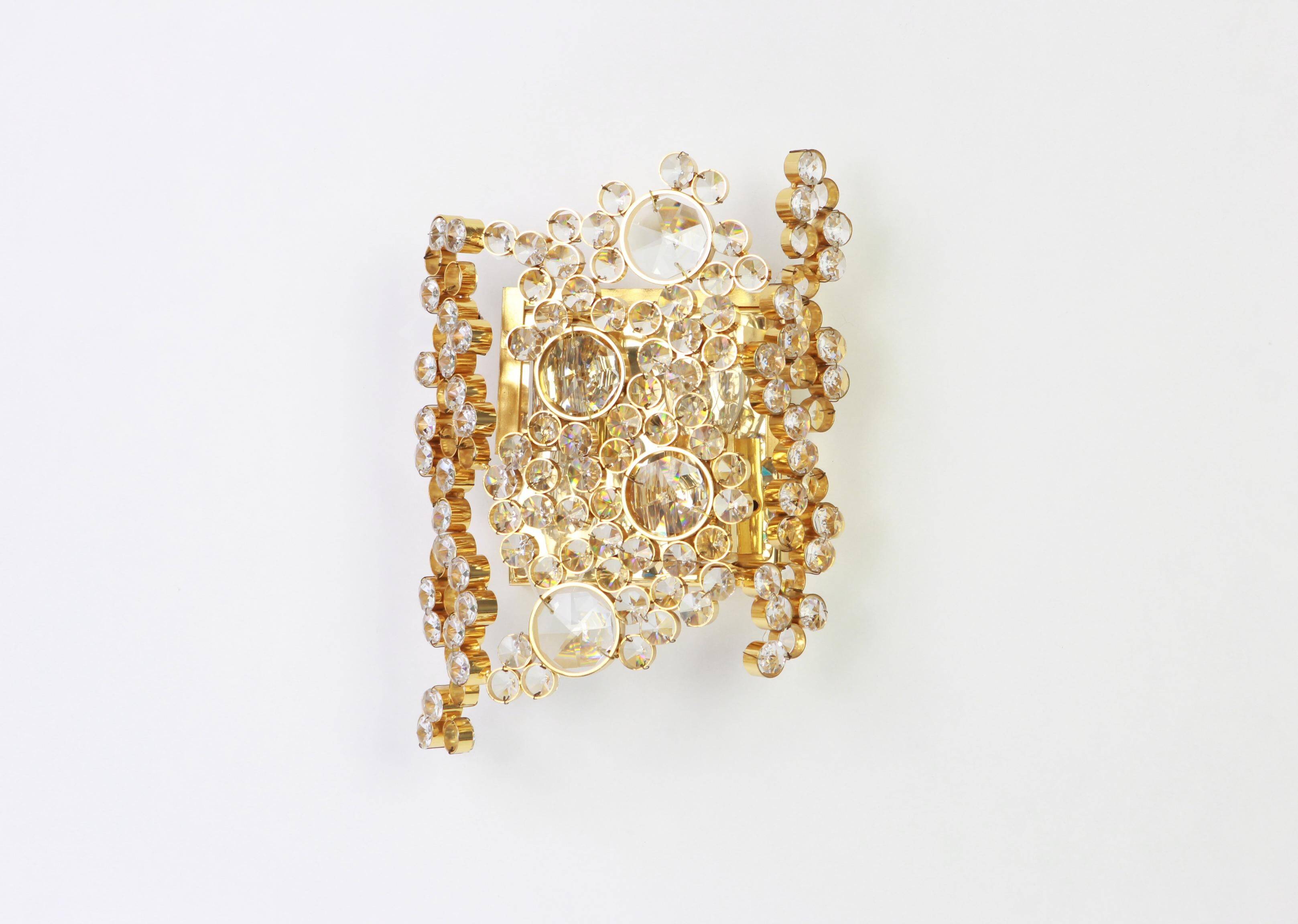 Pair of wall sconces in gilded brass and crystal by Palwa, Germany, 1960s.