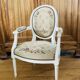 Upholstered armchair with cross-stitch in the Louis XVI style, 19th century.