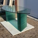 Solid glass desk with a half-moon top.