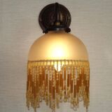 French vintage bronze effect single wall light with opaque beaded glass shade.