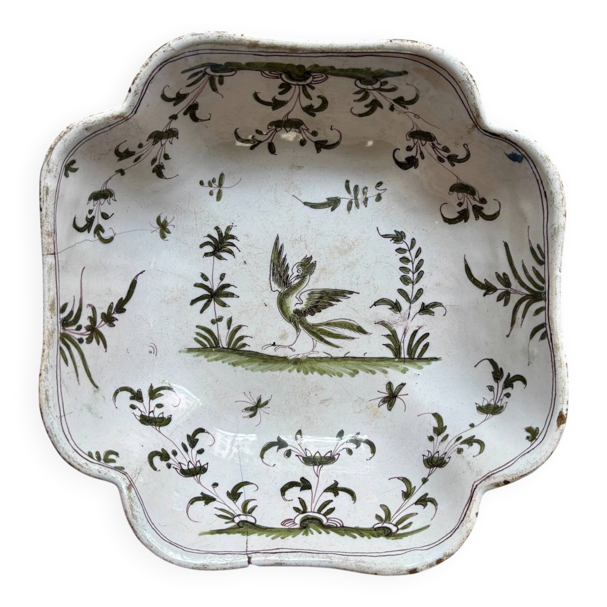 Moustiers salad bowl in cream and green earthenware, 18th century.