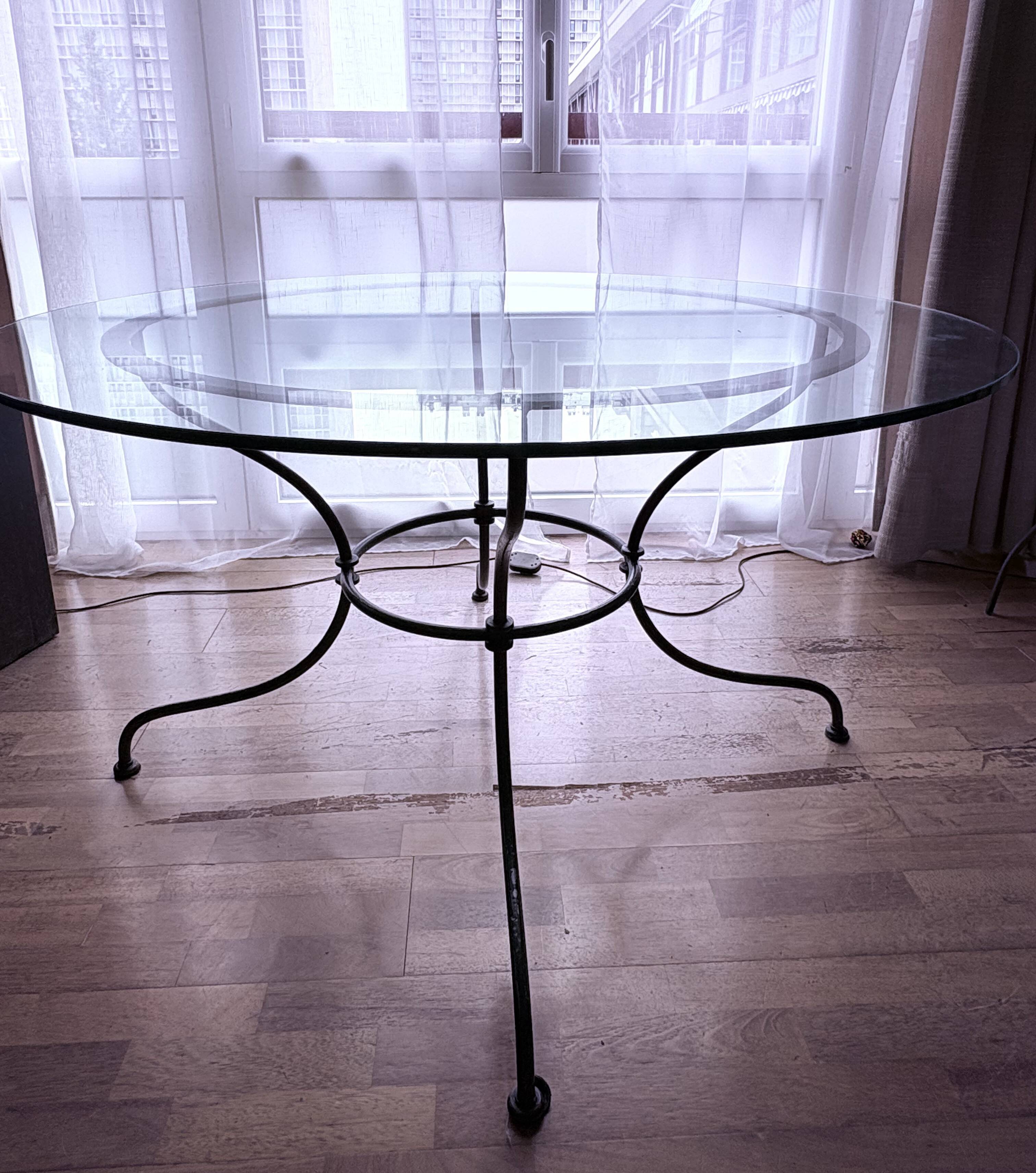 Round glass table - wrought iron base