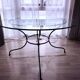 Round glass table - wrought iron base