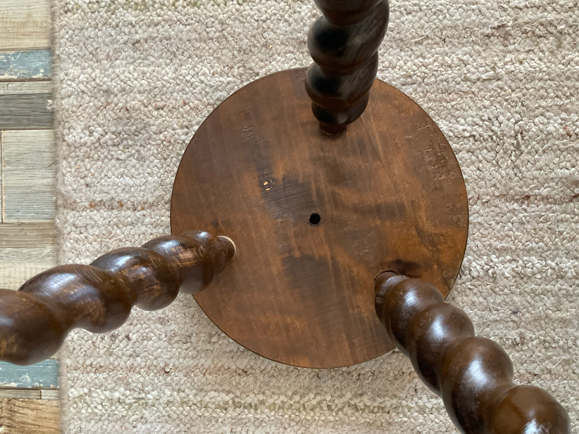 Antique tripod stool made of turned wood