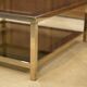 Hollywood Regency coffee table in smoked glass with mirrored framing from the 1970s.