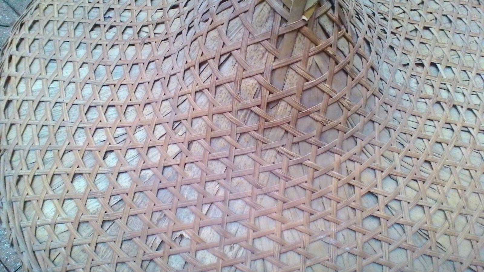 Vintage Asian hat braided palms and bamboo for decoration