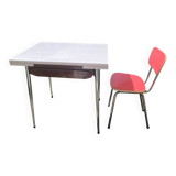 Formica table with a red Mid-century chair.