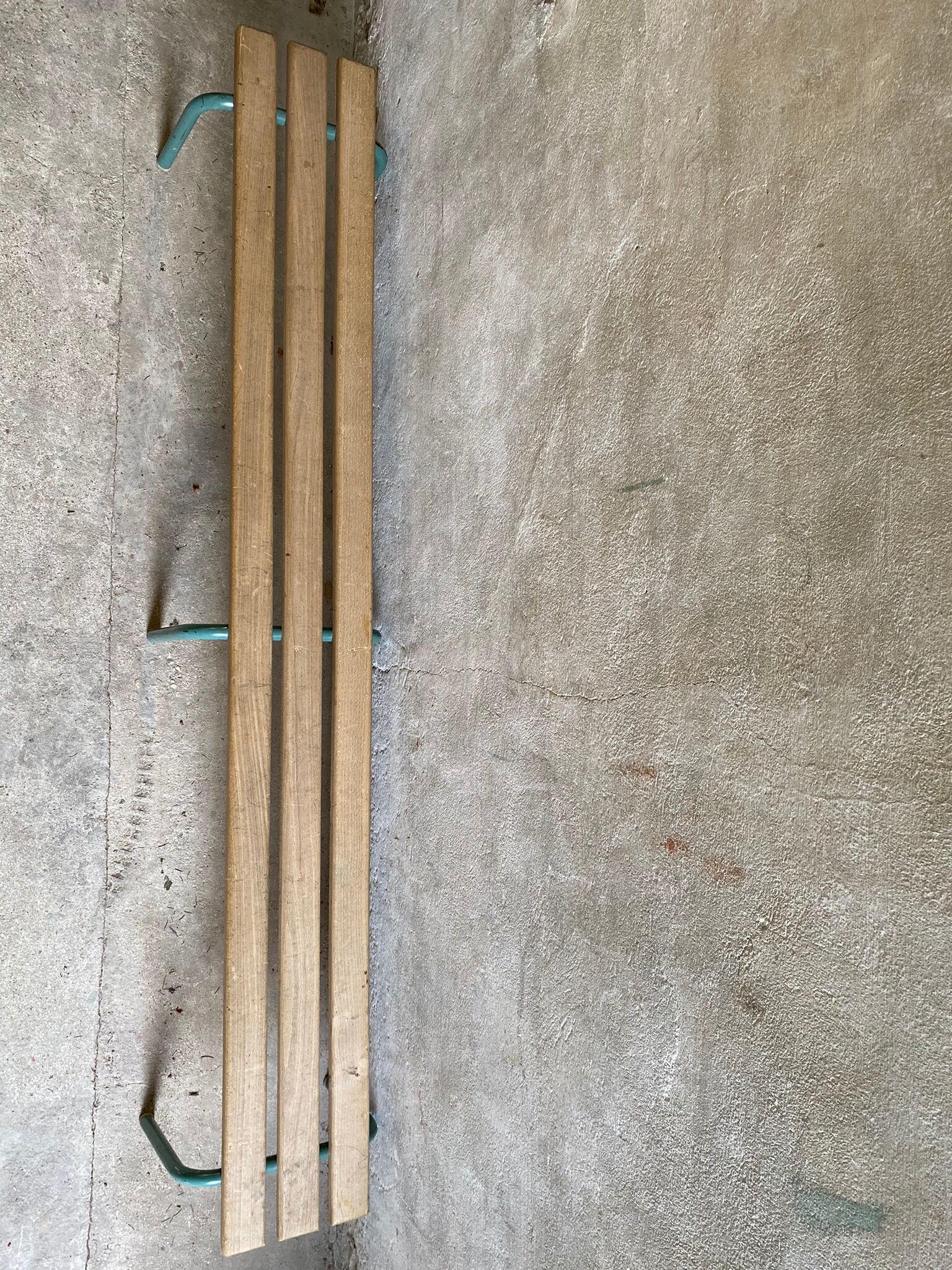 Vintage wood kindergarten bench and tubular structure in long