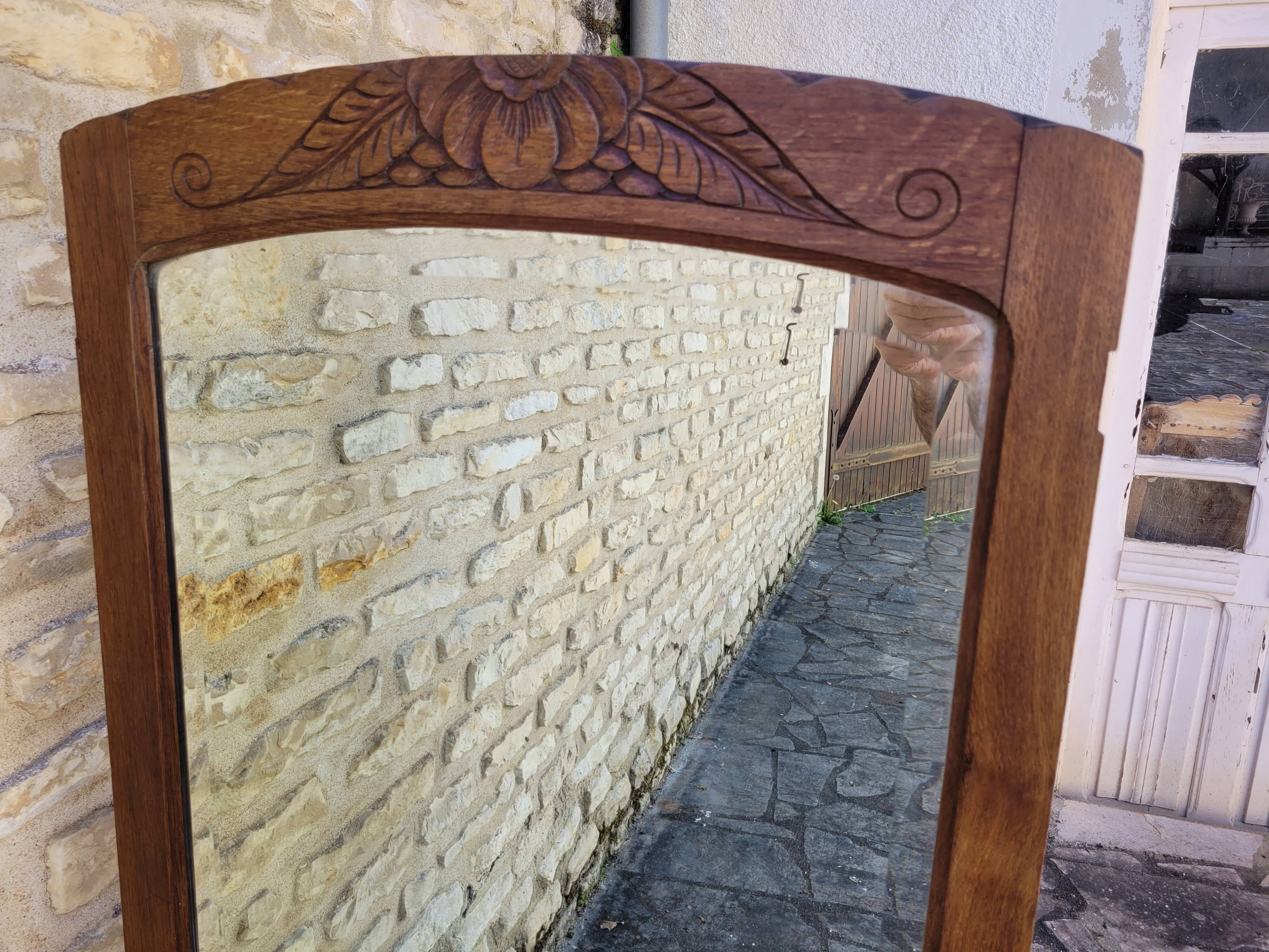 Art Deco oak mirror with bevelled glass from the 1930s.