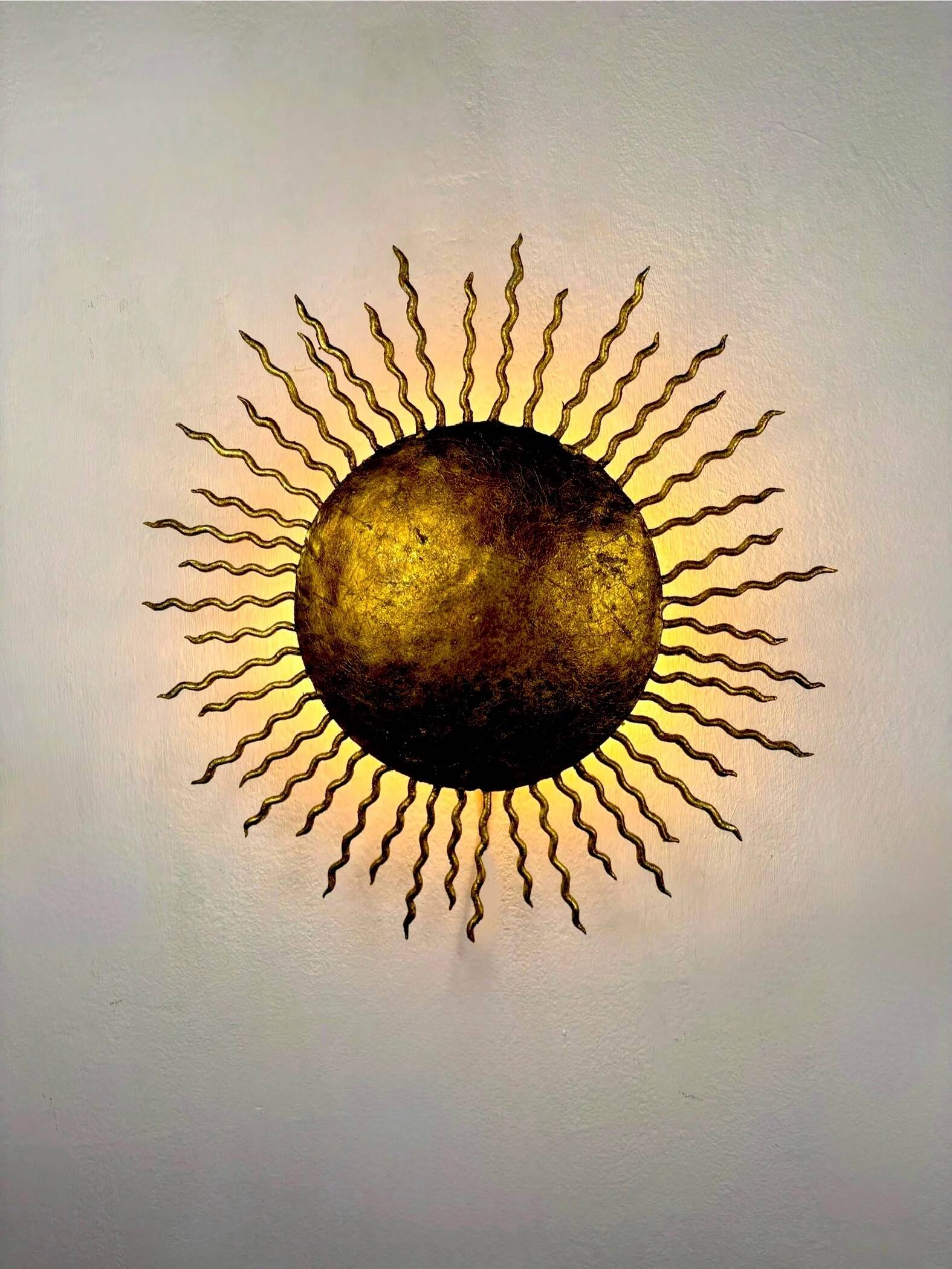 French gilt metal sunburst light fixture, Gilbert Poillerat, 1930s France