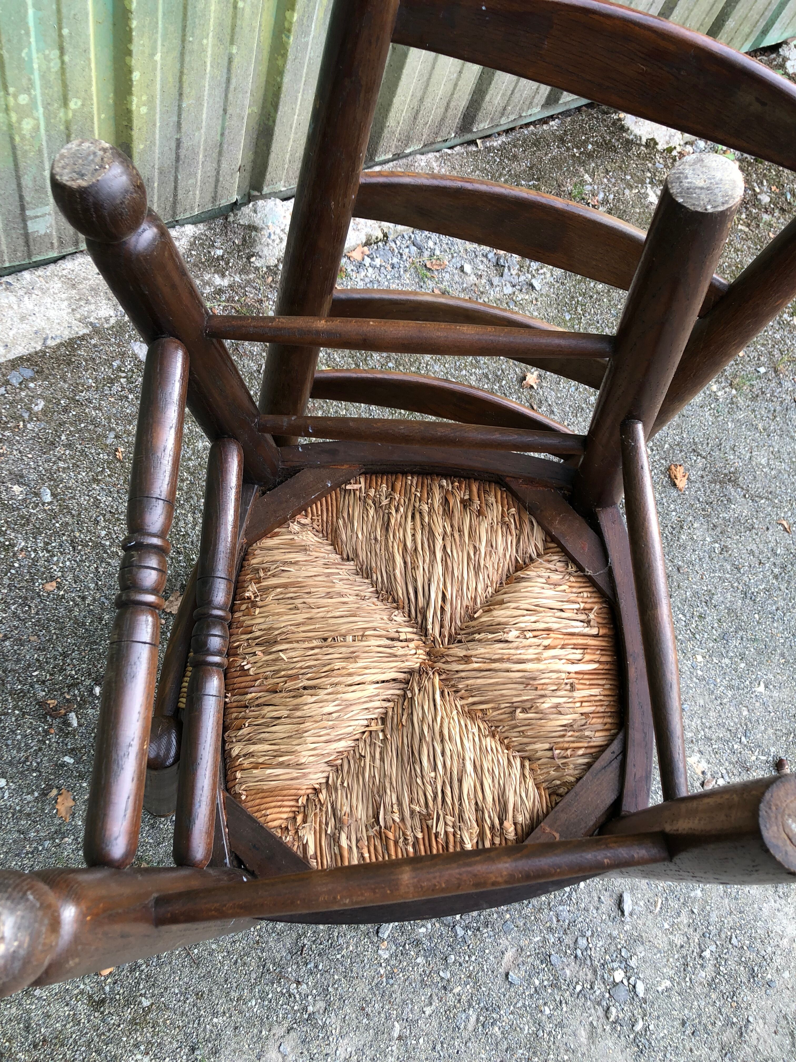Duo of vintage rustic straw straw chairs in oak.