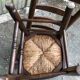 Duo of vintage rustic straw straw chairs in oak.
