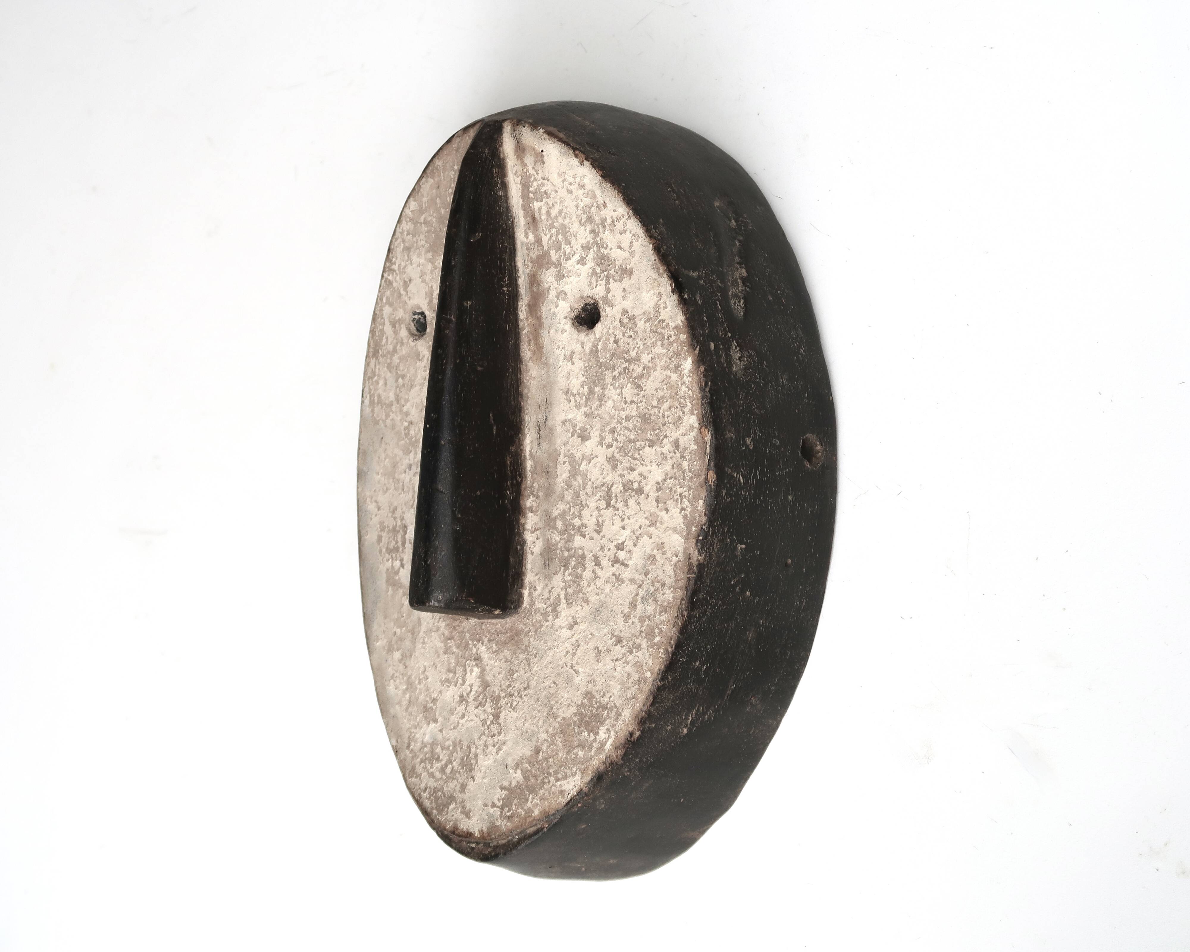 Minimalist wooden African wall mask, vintage Africa