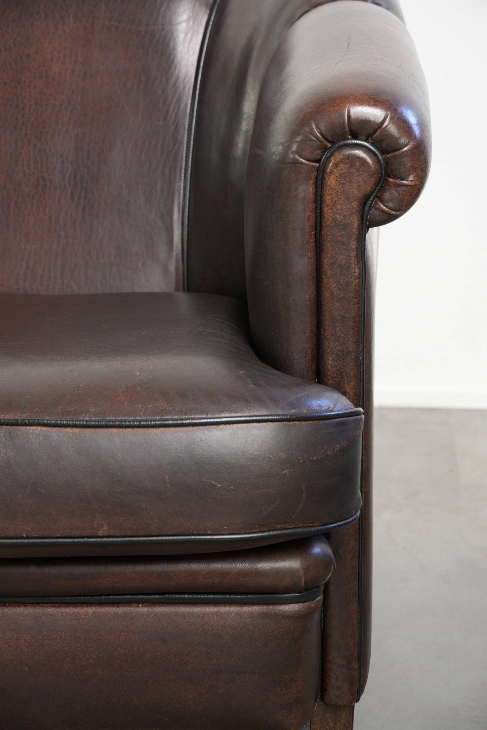 Unique sheepskin 3-seater sofa with deep colours and a distinctive design