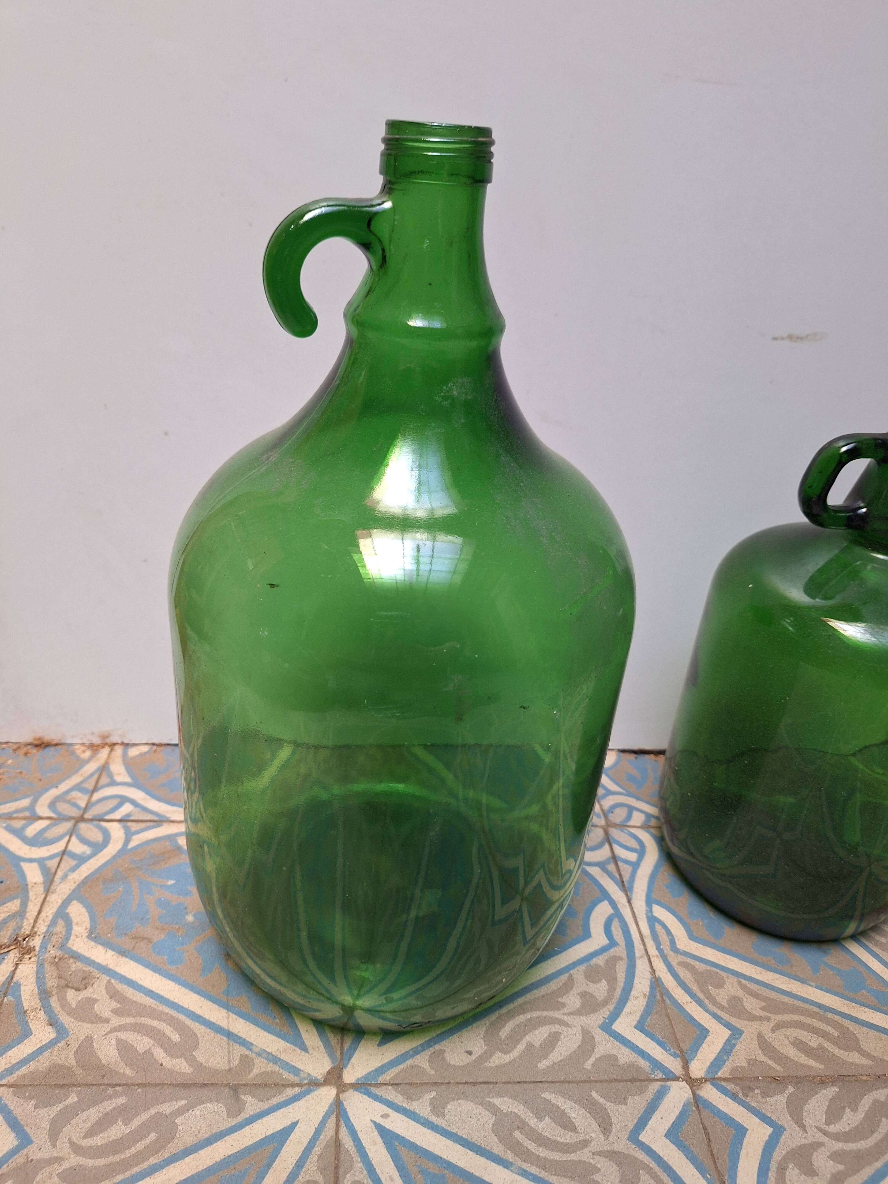 Set of 2 vintage green glass Demijohns.