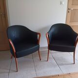 Pair of leather and wood armchairs in the Umberto Asnago style.