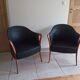 Pair of leather and wood armchairs in the style of Umberto Asnago.