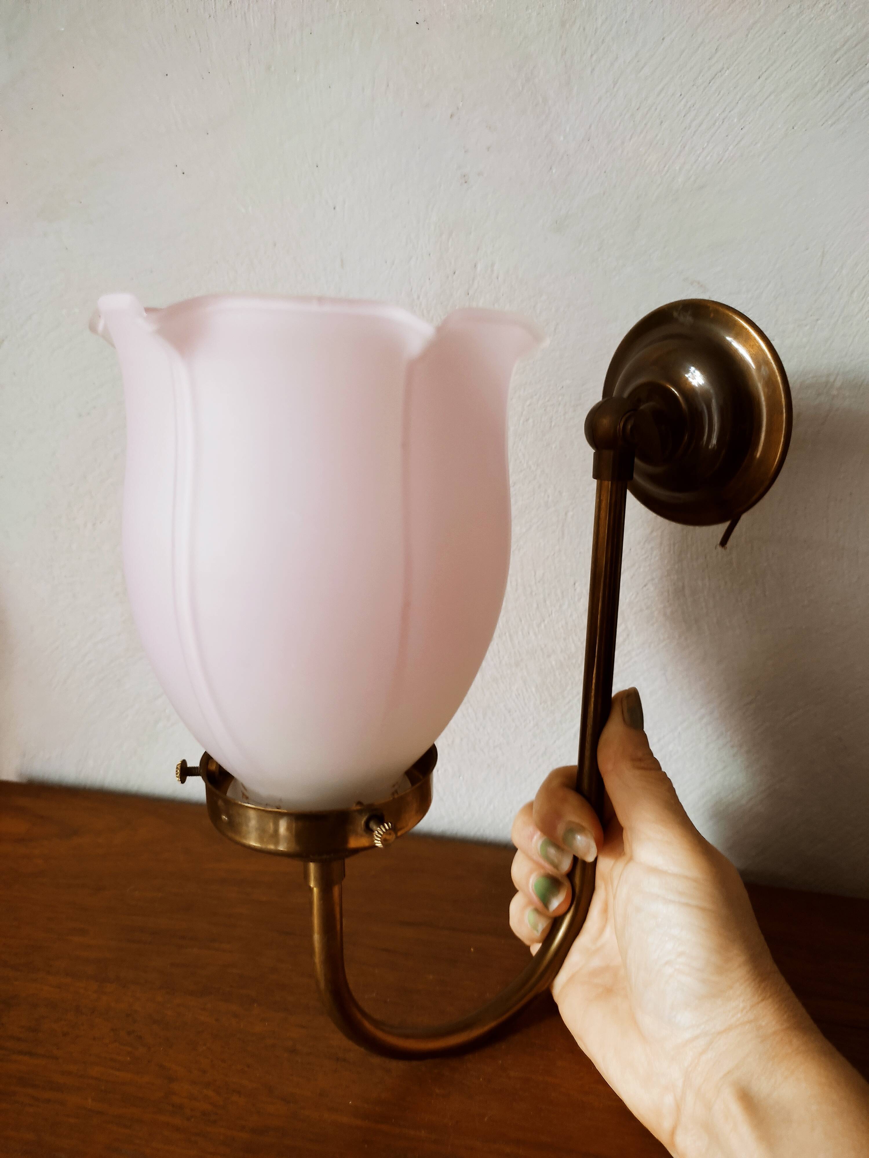Brass wall lamp with pale pink bell