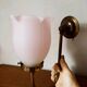Brass wall lamp with pale pink bell