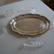 Silver-plated metal aperitif serving tray with HKE hallmark and glass.