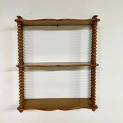 Vintage turned wood wall shelf with 3 levels.