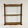Vintage turned wood wall shelf with 3 levels.