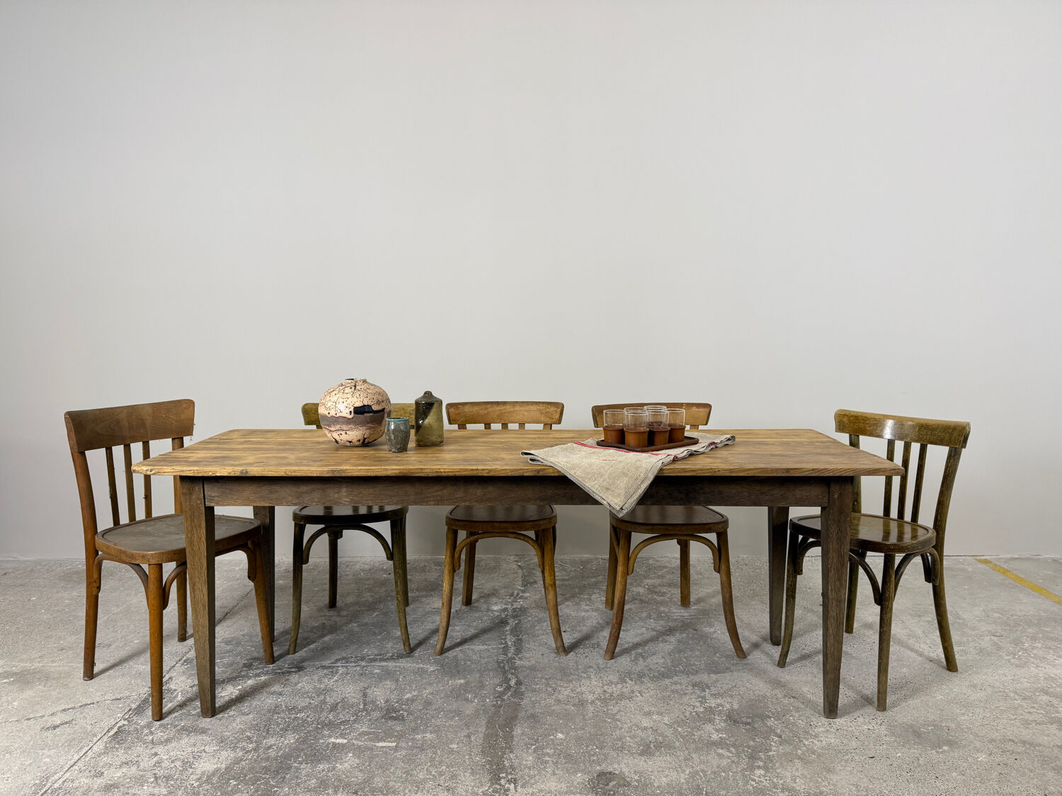 Old farmhouse table with tapered legs, late 19th to early 20th century.