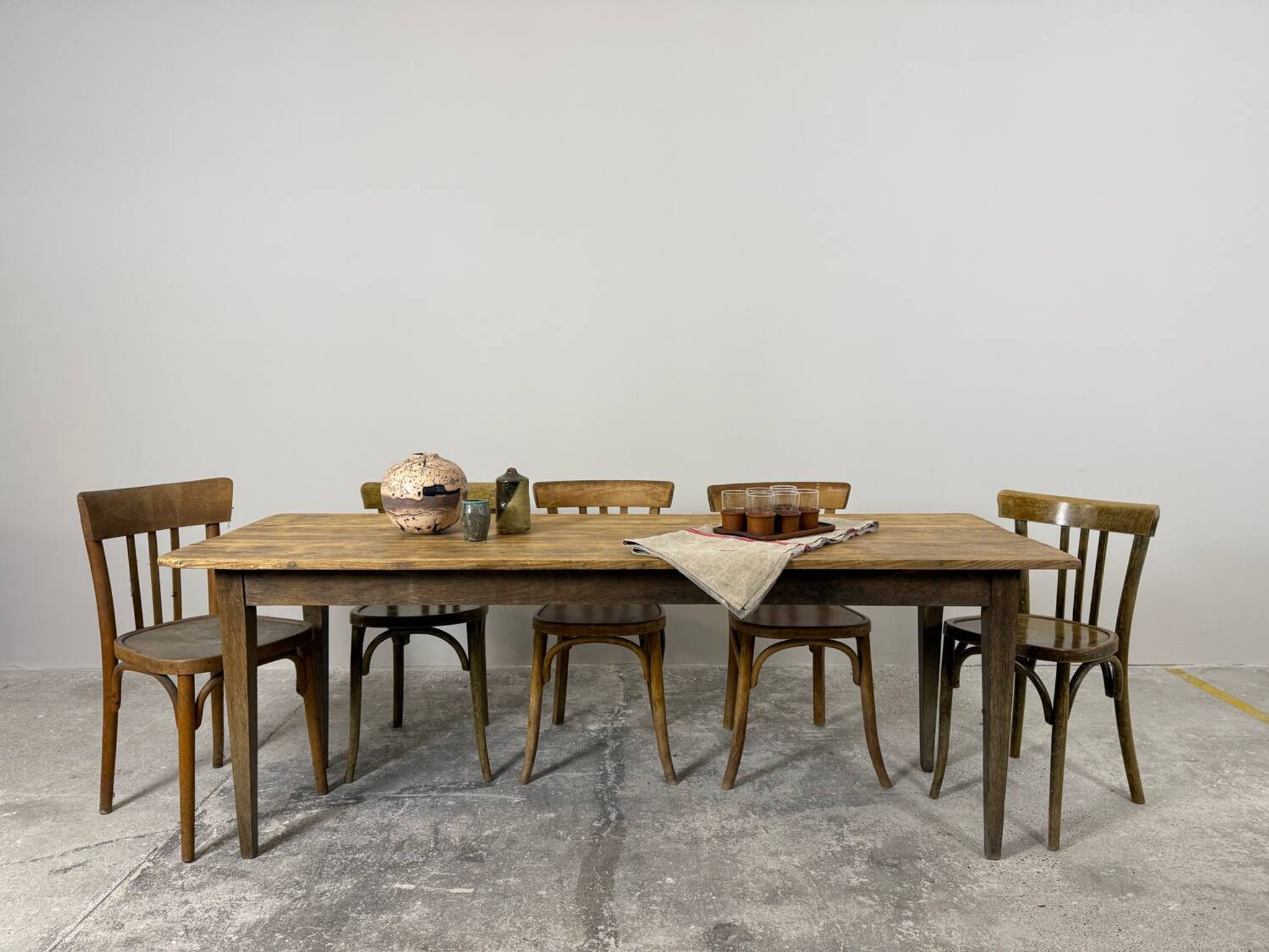 Old farmhouse table with tapered legs, late 19th to early 20th century.