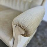 Vintage beige sofa with fringes