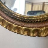 Oval Florentine mirror in powder pink and gold wood, 1960s.