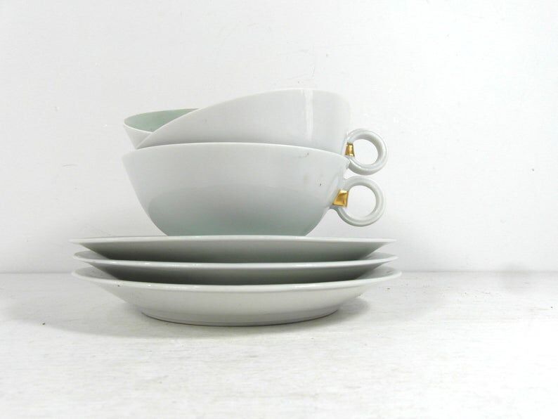 White porcelain and mint cups and saucers, half a cup