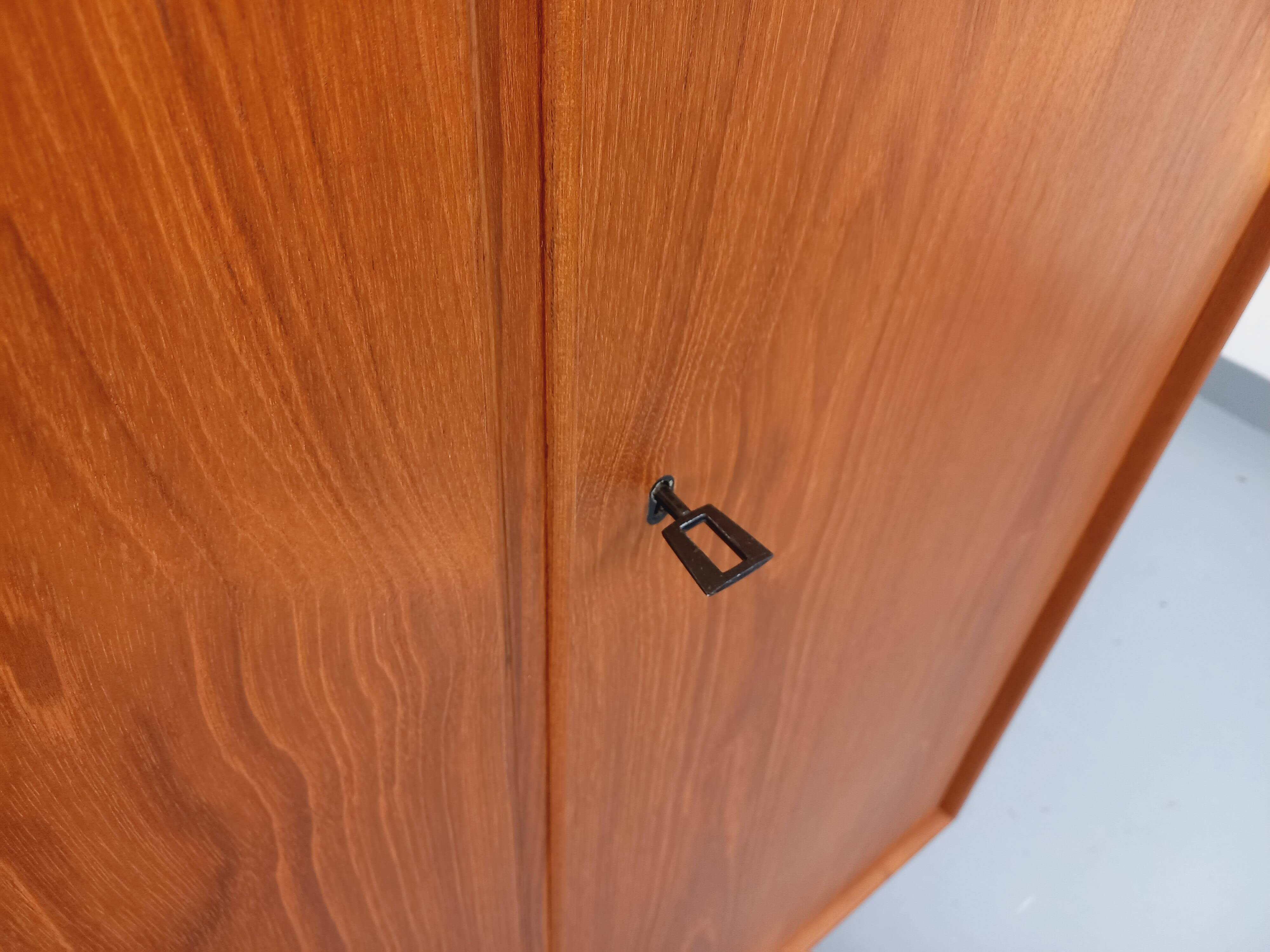 Vintage Scandinavian modernist wardrobe in teak and metal from the 1960s.