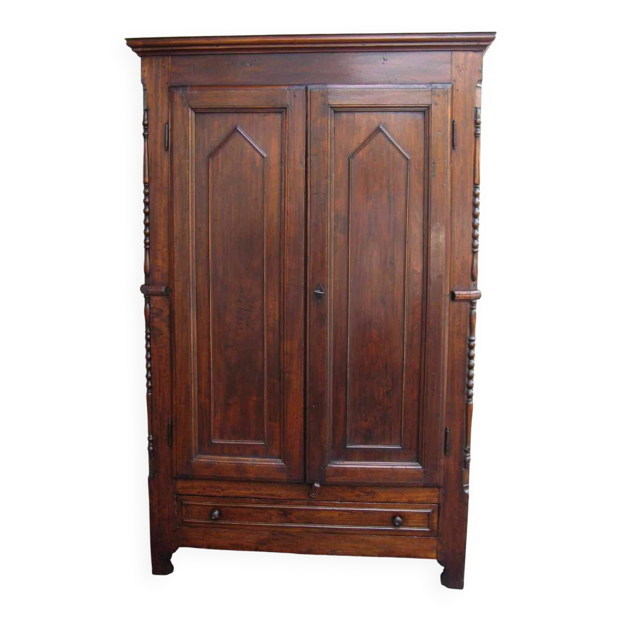 Antique solid wood wardrobe in historical rustic style from the 19th century.