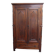 Antique solid wood wardrobe in historical rustic style from the 19th century.