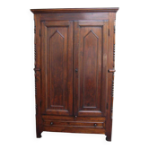 Antique solid wood wardrobe in historical rustic style from the 19th century.