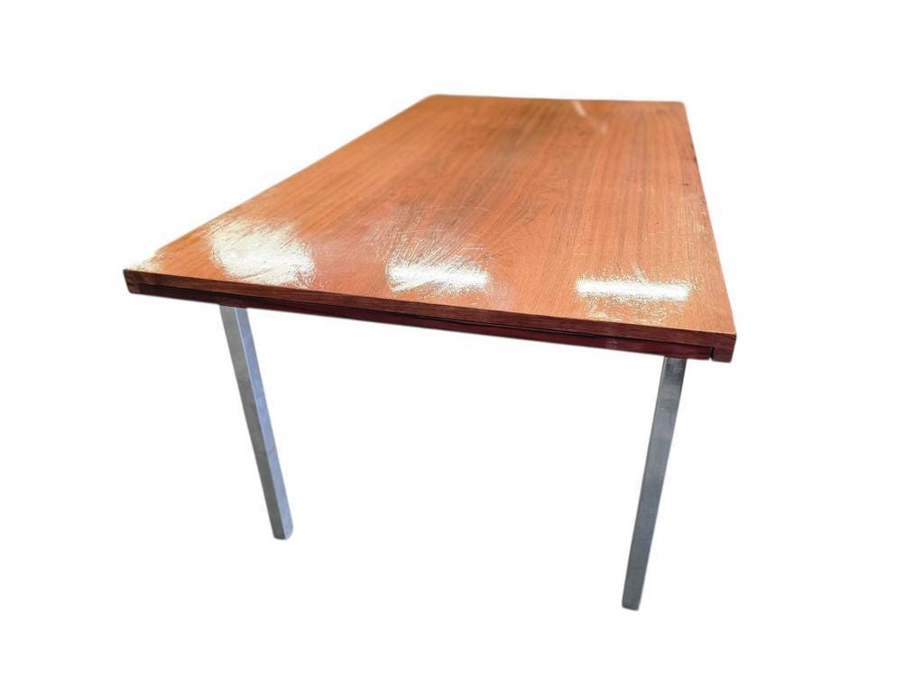 Vintage wooden dining table with chrome frame.