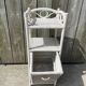 Small white wicker bathroom shelf