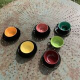 Coffee service composed of 5 cups and saucers in black earthenware and different colored interiors