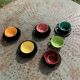 Coffee service composed of 5 cups and saucers in black earthenware and different colored interiors