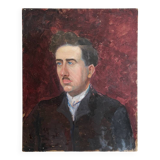 Old oil painting on cardboard portrait of a man in a dark suit
