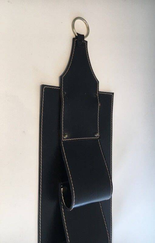 Leather wall-mounted magazine rack. Attributed to Jacques Adnet