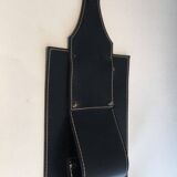 Leather wall-mounted magazine rack. Attributed to Jacques Adnet