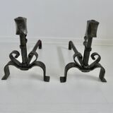 Pair of ironwork andirons in the style of Raymond Subes, circa 1940
