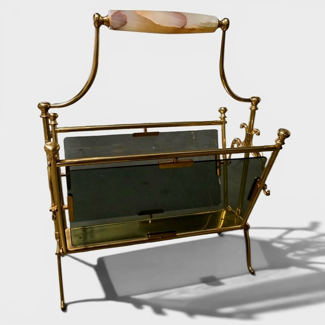 Exceptional magazine rack in brass, smoked glass and Onyx handle.