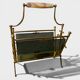 Exceptional magazine rack in brass, smoked glass and Onyx handle.