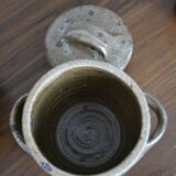 Sandstone pot with handles hands